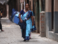 A health worker is walking during a polio vaccination campaign in Patan, Lalitpur, on July 24, 2024. The Nepal government is starting a four...