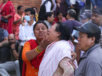 Family members and relatives of Nepal's domestic flight carrier Saurya Airlines are waiting for the bodies of their loved ones outside the m...