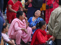 Family members and relatives of Nepal's domestic flight carrier Saurya Airlines are waiting for the bodies of their loved ones outside the m...