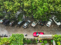 Vehicles are running on a flooded road after heavy rain in Sanmenxia, Henan province, China, on July 24, 2024. (