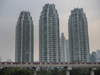 Cars of the LRT train are passing through the business district of Jakarta, Indonesia, on July 24, 2024. (