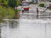 A street is flooding after a strong storm and downpour in Gdansk, Poland, on July 24, 2024. Heavy downpours and strong storms are causing nu...