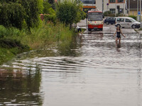 A street is flooding after a strong storm and downpour in Gdansk, Poland, on July 24, 2024. Heavy downpours and strong storms are causing nu...