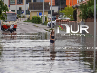 A street is flooding after a strong storm and downpour in Gdansk, Poland, on July 24, 2024. Heavy downpours and strong storms are causing nu...