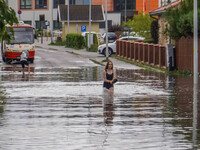 A street is flooding after a strong storm and downpour in Gdansk, Poland, on July 24, 2024. Heavy downpours and strong storms are causing nu...