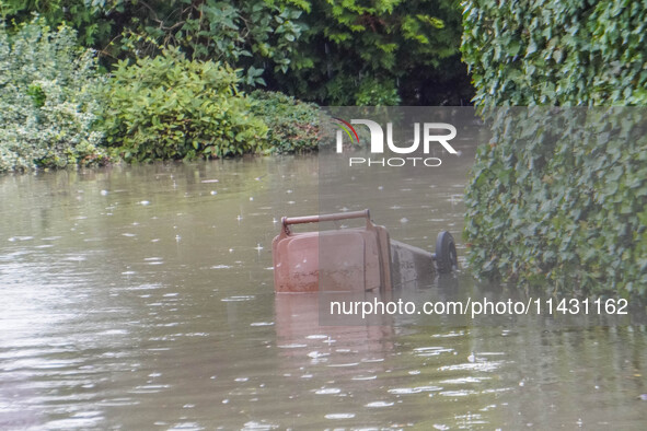 A street is flooding after a strong storm and downpour in Gdansk, Poland, on July 24, 2024. Heavy downpours and strong storms are causing nu...