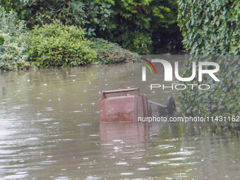 A street is flooding after a strong storm and downpour in Gdansk, Poland, on July 24, 2024. Heavy downpours and strong storms are causing nu...