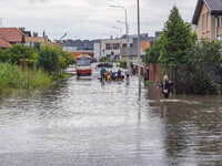 A street is flooding after a strong storm and downpour in Gdansk, Poland, on July 24, 2024. Heavy downpours and strong storms are causing nu...