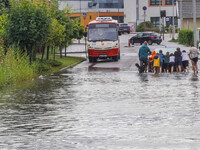 A street is flooding after a strong storm and downpour in Gdansk, Poland, on July 24, 2024. Heavy downpours and strong storms are causing nu...