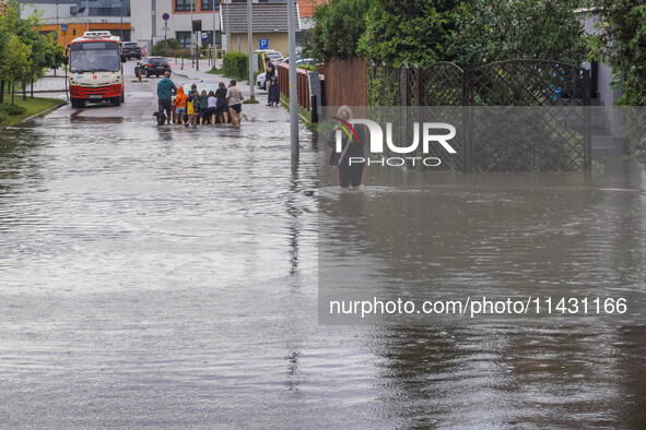 A street is flooding after a strong storm and downpour in Gdansk, Poland, on July 24, 2024. Heavy downpours and strong storms are causing nu...