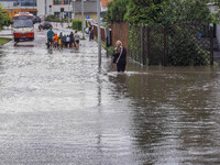 A street is flooding after a strong storm and downpour in Gdansk, Poland, on July 24, 2024. Heavy downpours and strong storms are causing nu...