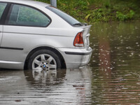 A street is flooding after a strong storm and downpour in Gdansk, Poland, on July 24, 2024. Heavy downpours and strong storms are causing nu...