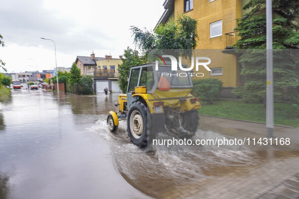 A street is flooding after a strong storm and downpour in Gdansk, Poland, on July 24, 2024. Heavy downpours and strong storms are causing nu...