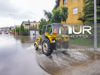 A street is flooding after a strong storm and downpour in Gdansk, Poland, on July 24, 2024. Heavy downpours and strong storms are causing nu...