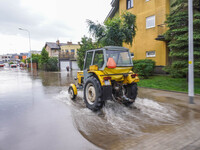 A street is flooding after a strong storm and downpour in Gdansk, Poland, on July 24, 2024. Heavy downpours and strong storms are causing nu...