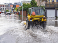 A street is flooding after a strong storm and downpour in Gdansk, Poland, on July 24, 2024. Heavy downpours and strong storms are causing nu...