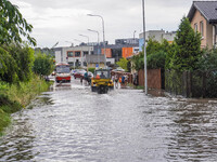 A street is flooding after a strong storm and downpour in Gdansk, Poland, on July 24, 2024. Heavy downpours and strong storms are causing nu...