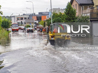 A street is flooding after a strong storm and downpour in Gdansk, Poland, on July 24, 2024. Heavy downpours and strong storms are causing nu...