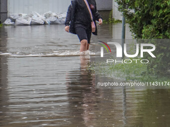 A street is flooding after a strong storm and downpour in Gdansk, Poland, on July 24, 2024. Heavy downpours and strong storms are causing nu...