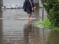 A street is flooding after a strong storm and downpour in Gdansk, Poland, on July 24, 2024. Heavy downpours and strong storms are causing nu...