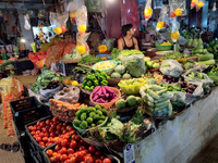 A person is selling vegetables inside a market in Kolkata, India, on July 24, 2024. (