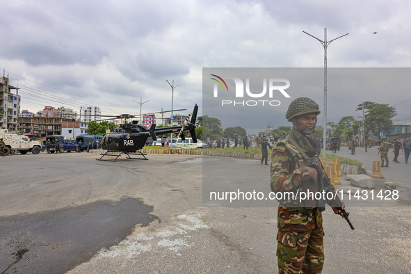 Bangladeshi military forces are patrolling on armored vehicles on the streets of Dhaka, Bangladesh, on July 22, 2024. 