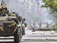 Bangladeshi military force soldiers are patrolling a street during a nationwide curfew in Dhaka, Bangladesh, on July 20, 2024. (