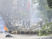 Bangladeshi military force soldiers are patrolling a street during a nationwide curfew in Dhaka, Bangladesh, on July 20, 2024. (