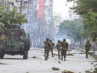 Bangladeshi military force soldiers are patrolling a street during a nationwide curfew in Dhaka, Bangladesh, on July 20, 2024. (