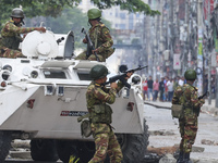 Bangladeshi military force soldiers are patrolling a street during a nationwide curfew in Dhaka, Bangladesh, on July 20, 2024. (