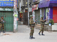 Bangladeshi military force soldiers are patrolling a street during a nationwide curfew in Dhaka, Bangladesh, on July 20, 2024. (