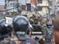 Bangladeshi military force soldiers are patrolling a street during a nationwide curfew in Dhaka, Bangladesh, on July 20, 2024. (