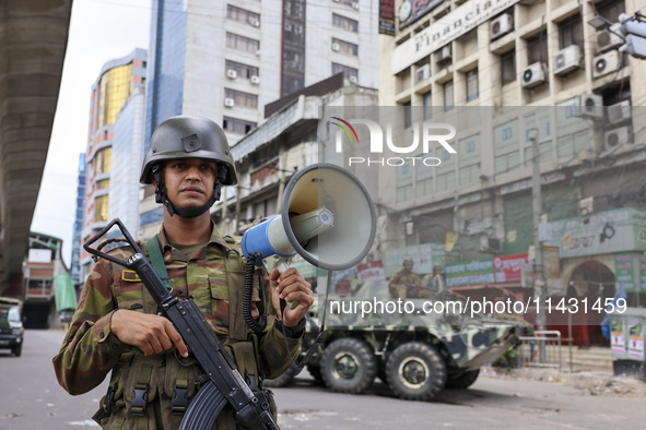 Bangladeshi military forces are patrolling on armored vehicles on the streets of Dhaka, Bangladesh, on July 21, 2024. 