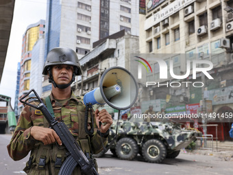 Bangladeshi military forces are patrolling on armored vehicles on the streets of Dhaka, Bangladesh, on July 21, 2024. (