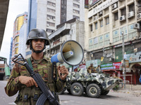 Bangladeshi military forces are patrolling on armored vehicles on the streets of Dhaka, Bangladesh, on July 21, 2024. (