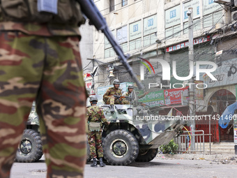 Bangladeshi military forces are patrolling on armored vehicles on the streets of Dhaka, Bangladesh, on July 21, 2024. (