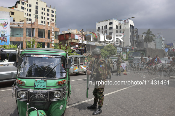 Bangladeshi military forces are patrolling on armored vehicles on the streets of Dhaka, Bangladesh, on July 21, 2024. 