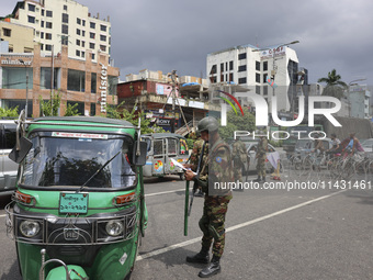 Bangladeshi military forces are patrolling on armored vehicles on the streets of Dhaka, Bangladesh, on July 21, 2024. (