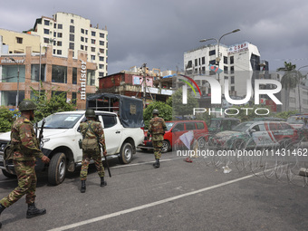 Bangladeshi military forces are patrolling on armored vehicles on the streets of Dhaka, Bangladesh, on July 21, 2024. (