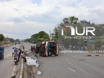 Bangladeshi military forces are patrolling on armored vehicles on the streets of Dhaka, Bangladesh, on July 22, 2024. (