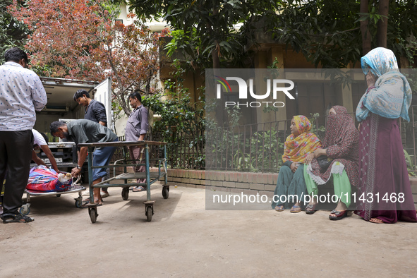 A relative of a protester is waiting for a dead body in Dhaka, Bangladesh, on July 22, 2024. 