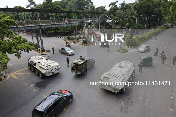 Bangladeshi military forces are patrolling on armored vehicles on the streets of Dhaka, Bangladesh, on July 22, 2024. 