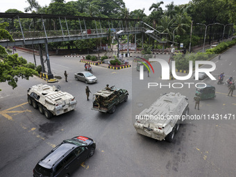 Bangladeshi military forces are patrolling on armored vehicles on the streets of Dhaka, Bangladesh, on July 22, 2024. (