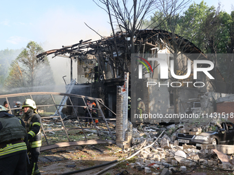 Firefighters are dealing with the damage done to a residential area in the city centre hit by a Russian guided bomb in Kharkiv, Ukraine, on...