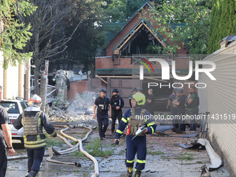 Firefighters are dealing with the damage done to a residential area in the city center hit by a Russian guided bomb in Kharkiv, Ukraine, on...