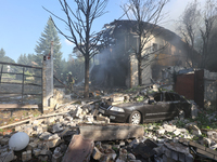 A car is being crushed by rubble in a residential area hit by a Russian guided bomb in central Kharkiv, Ukraine, on July 24, 2024. NO USE RU...