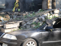 A car is being crushed by rubble in a residential area hit by a Russian guided bomb in central Kharkiv, Ukraine, on July 24, 2024. NO USE RU...