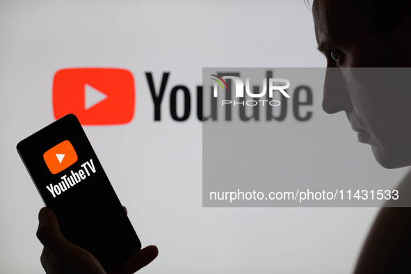 The YouTube TV logo is being displayed on a smartphone, with YouTube in the background, in this photo illustration in Brussels, Belgium, on...