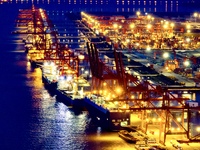 The container terminal of Taicang Port Phase 4 is being illuminated in Suzhou, Jiangsu province, China, on the evening of July 9, 2024. (