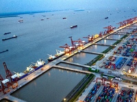 The container terminal of Taicang Port Phase 4 is being illuminated in Suzhou, Jiangsu province, China, on the evening of July 9, 2024. (